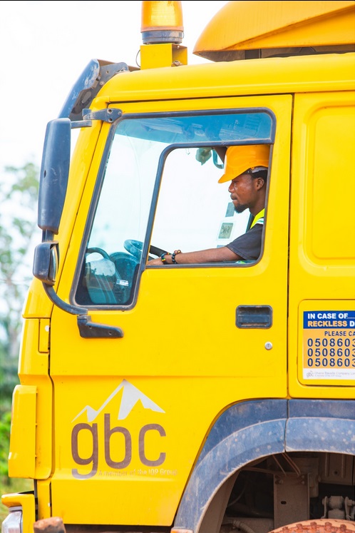 GBC driver wearing a hard hat in the cab