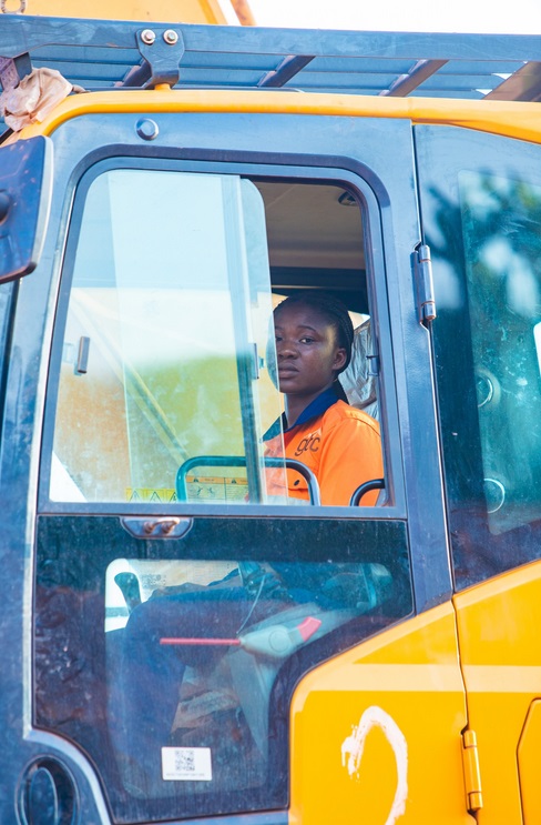 Female equipment operator in the cab